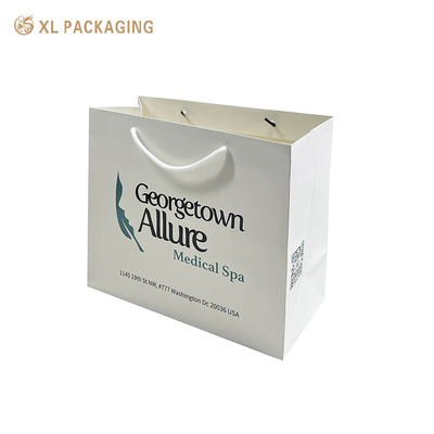 Custom Company Logo Paper Shopping Bags Высококачественные покрытые бумажные сумочки для одежды Обувь и розничная упаковка - прочные рукоятки Глянцевая/матовая ламинация и скидки на оптовые заказы